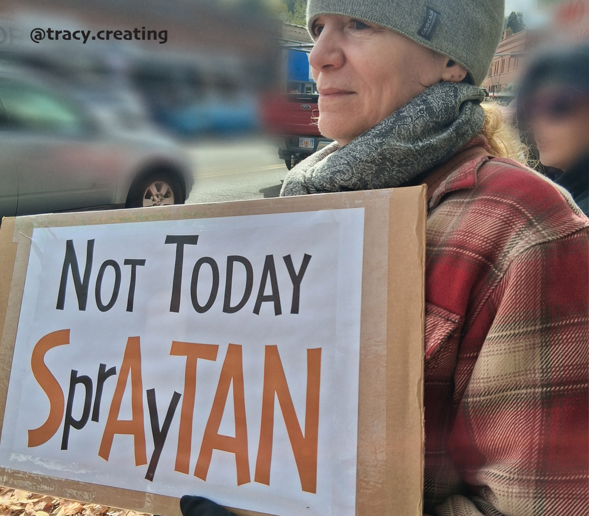 tracy holding a protest sign that says 'Not today SprAyTAN' - @tracy.creating